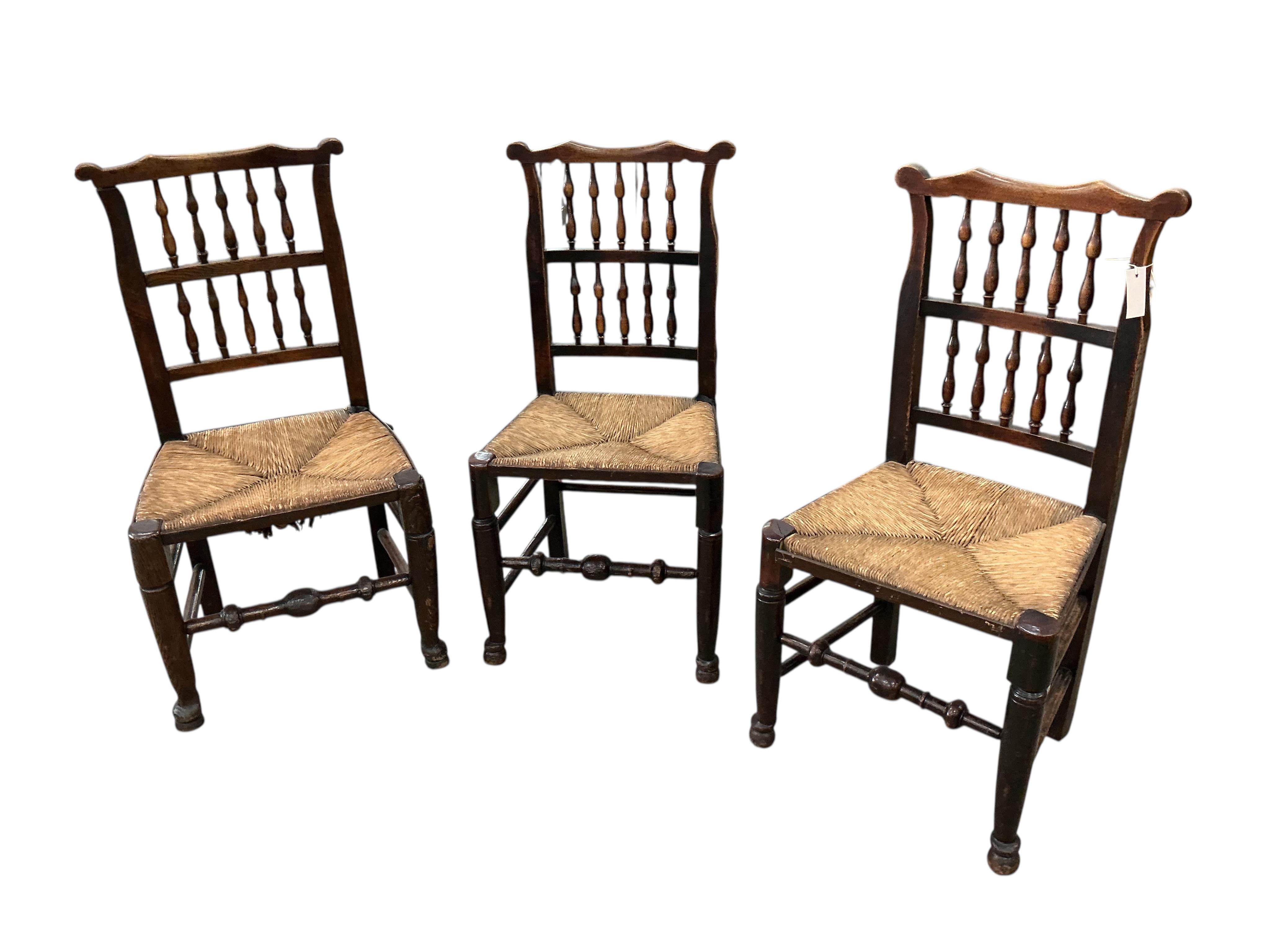 A harlequin set of six 19th century Lancashire beech and fruit wood rush seat dining chairs
